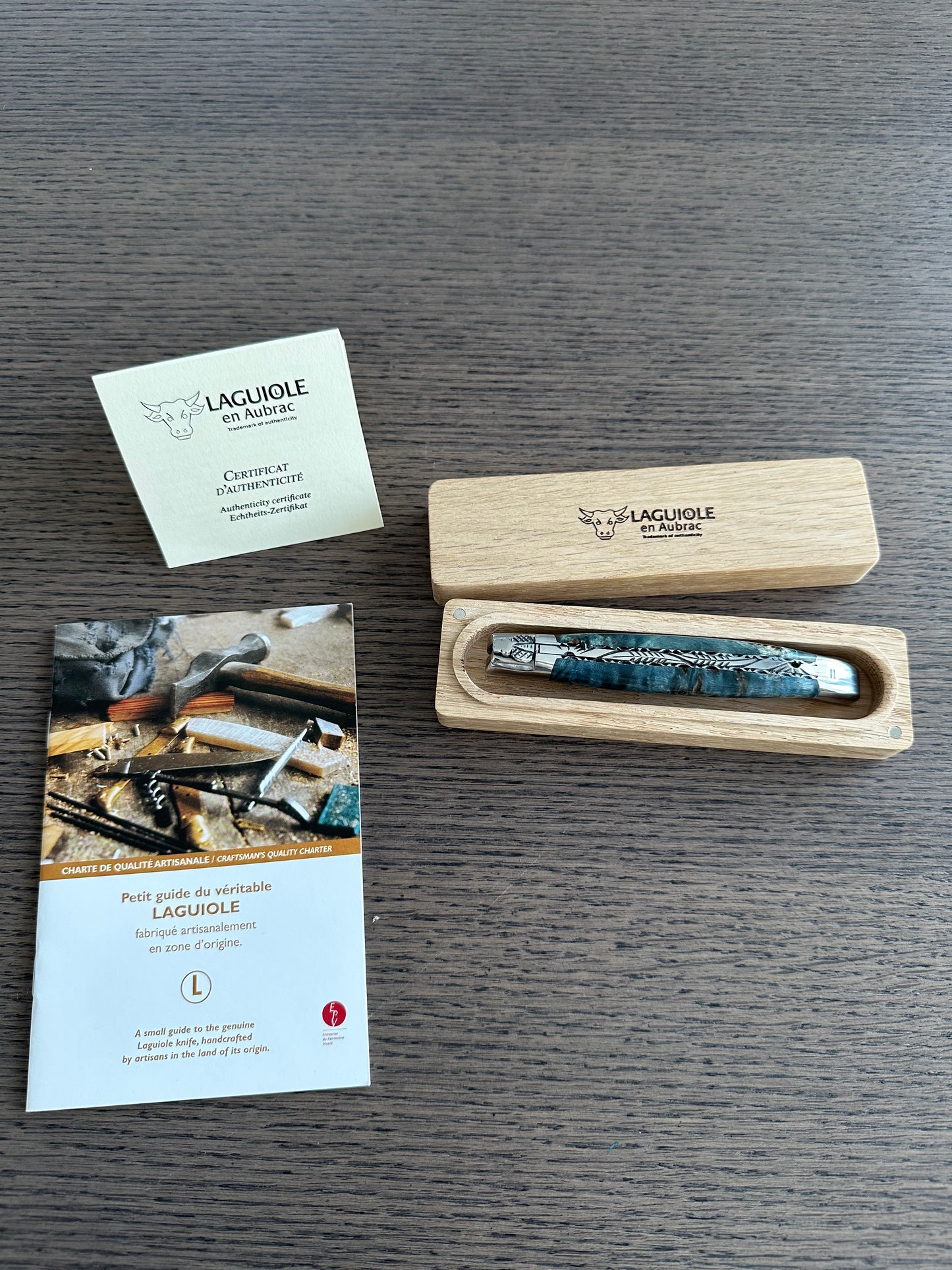 Laguiole en Aubrac Handcarved Plates Multipurpose Knife with Stabilized Blue Poplar Burl Handle, Polished Bolsters, 4.75-Inches