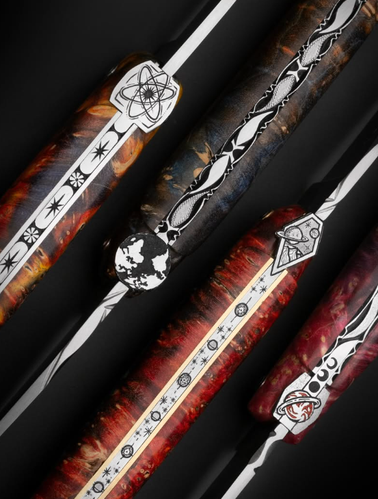 Laguiole en Aubrac folding knives with hand-chiseled celestial springs and red and blue burl wood handles