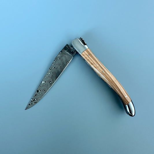 Laguiole en Aubrac Balbach Damascus Double-Plated Knife – Olive Wood, Polished Bolsters