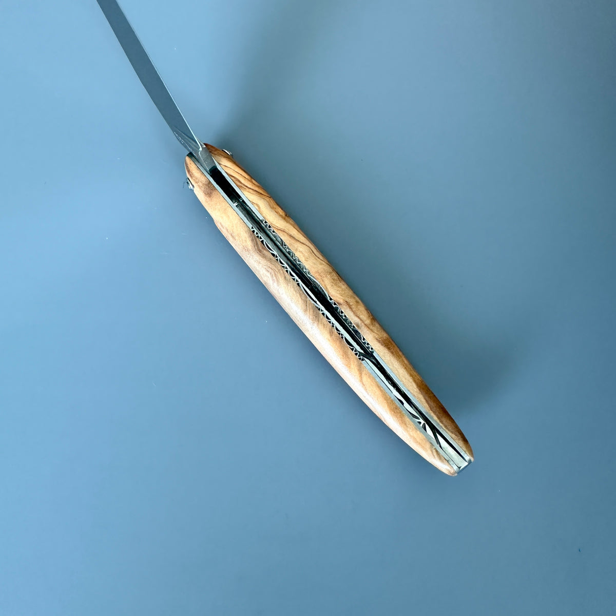 Laguiole Belle Piece Olive Wood partially open showing inner spine