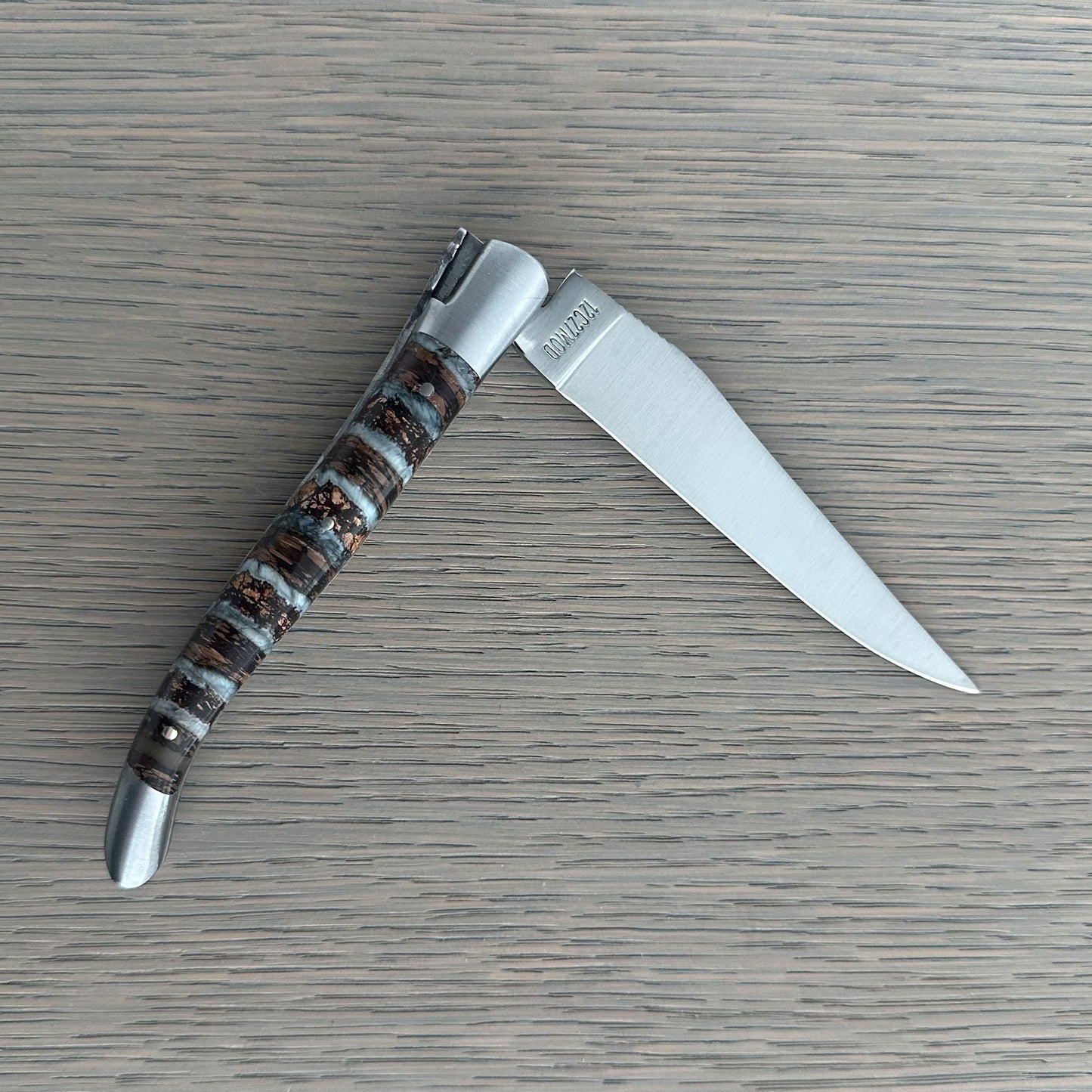 Sandvik 12C27 stainless steel blade on a Laguiole en Aubrac folding knife.
