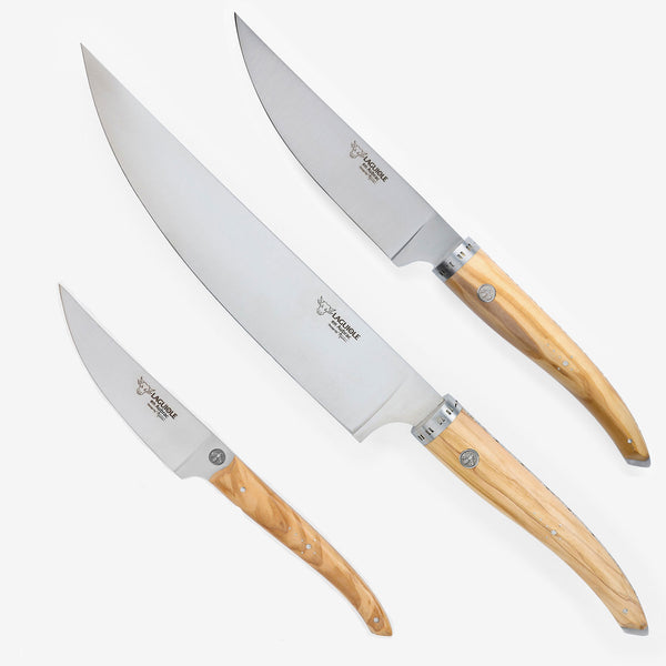 a group of knives with wooden handles