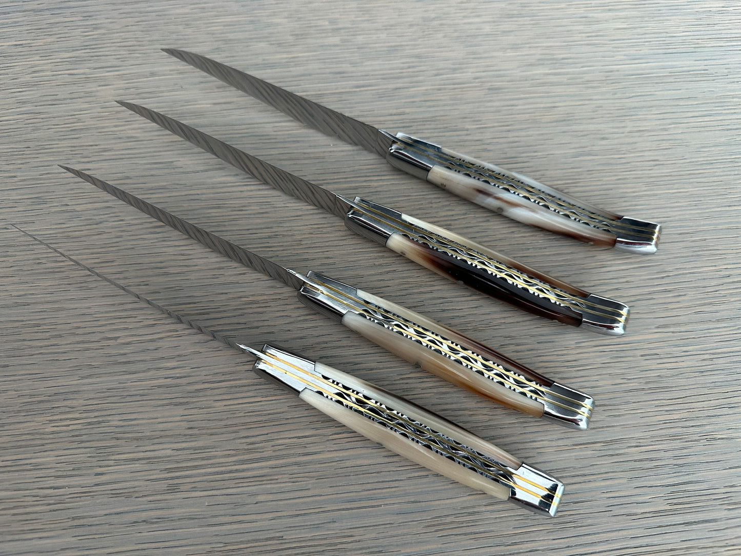 Laguiole en Aubrac Luxury Handcrafted Stainless Steel & Brass Double Plate 4-Piece Steak Knife Set with Solid Horn Handles