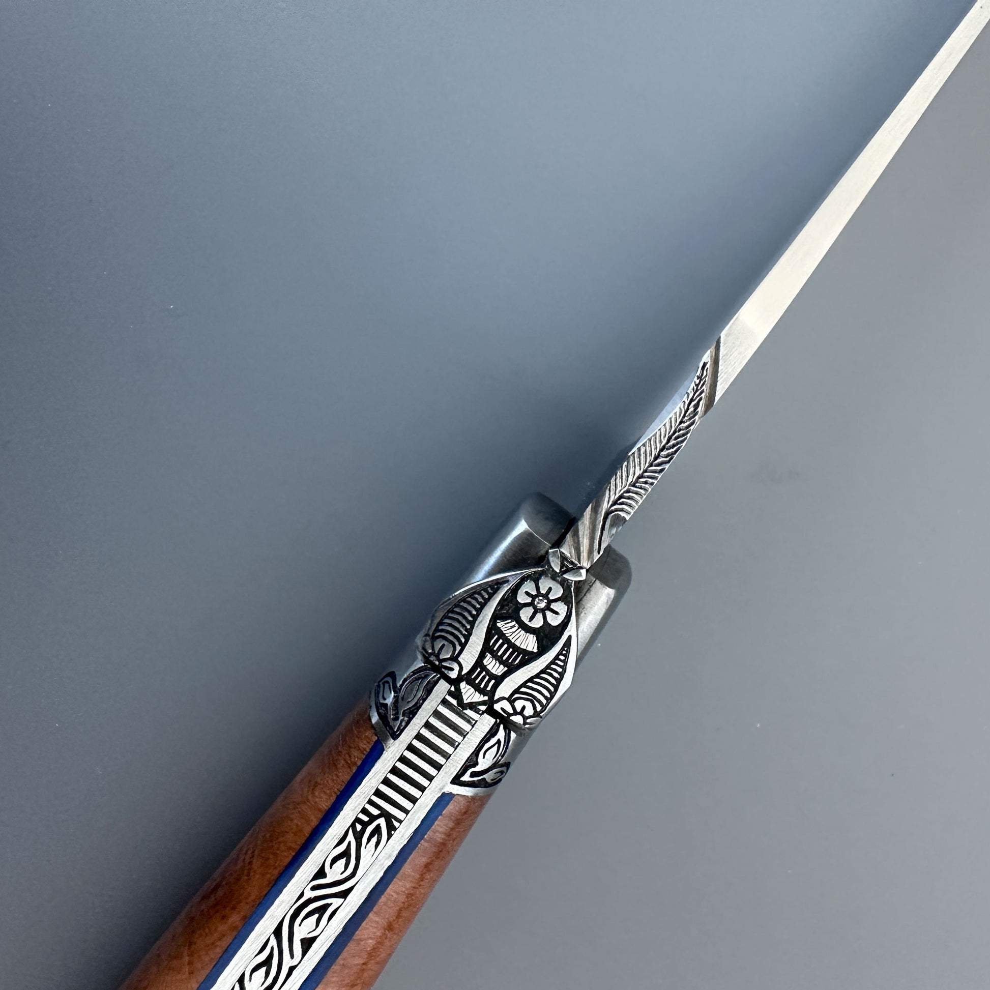 Close view of Gothic Bee from a Laguiole en Aubrac Aubrac Wood Belle Piece Knife