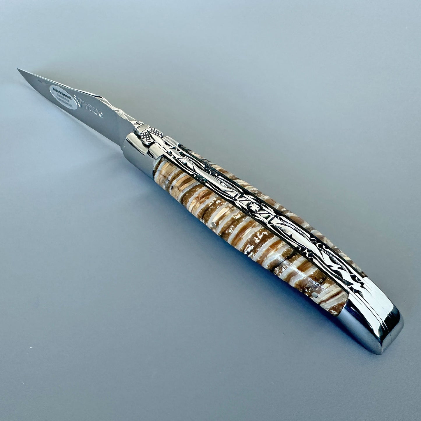 Open Laguiole en Aubrac double-plated folding knife with brown and beige mammoth molar handle