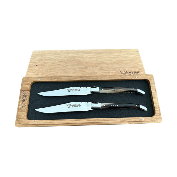 a set of knives in a wooden box
