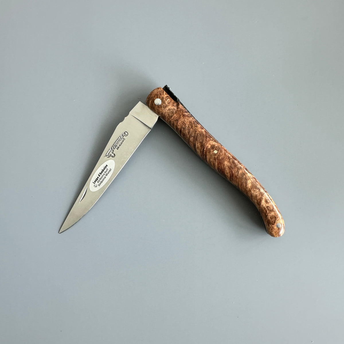 Laguiole en Aubrac folding knife with Amboyna burl wood handle partially open