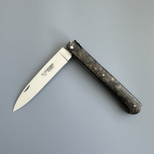 Laguiole Droit folding knife with dark burl handle, shown open on a gray background, showcasing its straight silhouette