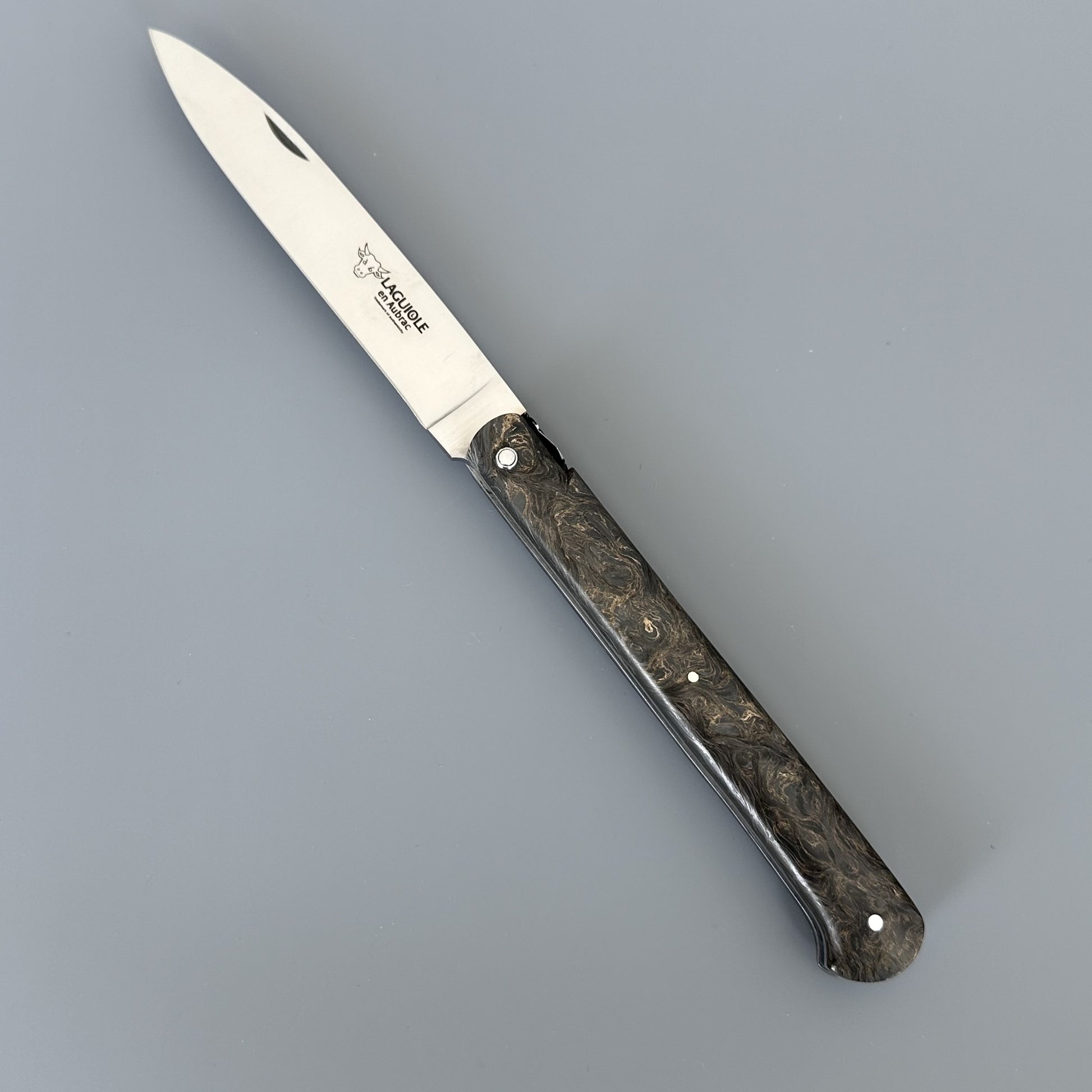 Laguiole Droit knife open, angled to show the full blade etched with the Laguiole en Aubrac bull logo