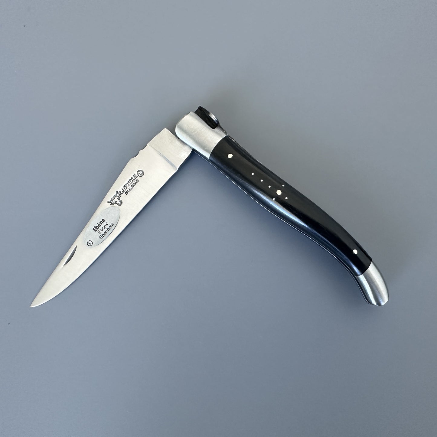 Laguiole en Aubrac folding knife with ebony handle, shown open, with blade ebony wood handle