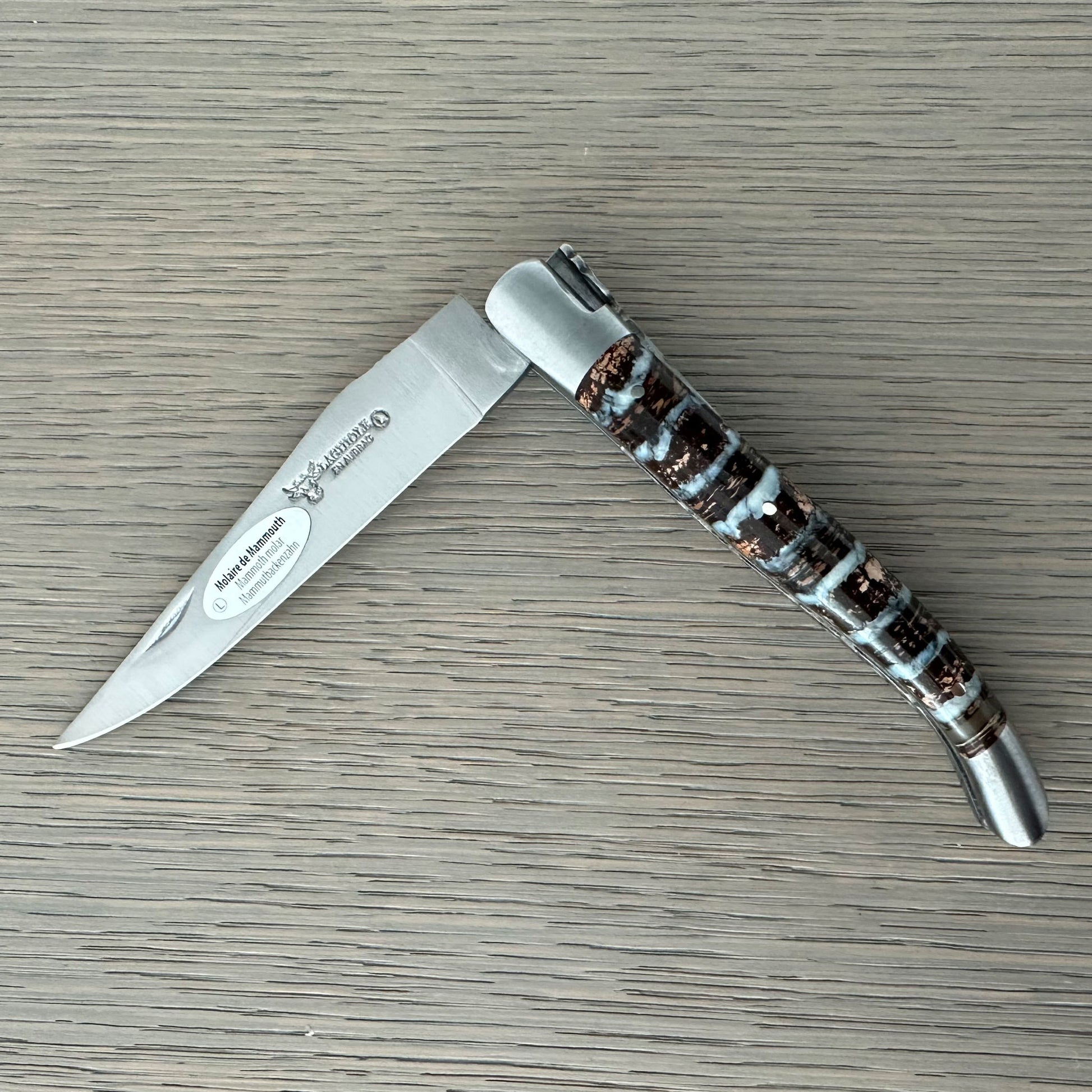 Laguiole en Aubrac Double-Plated folding knife with Light Brown Molar handle and Sandvik 12C27 stainless steel blade.
