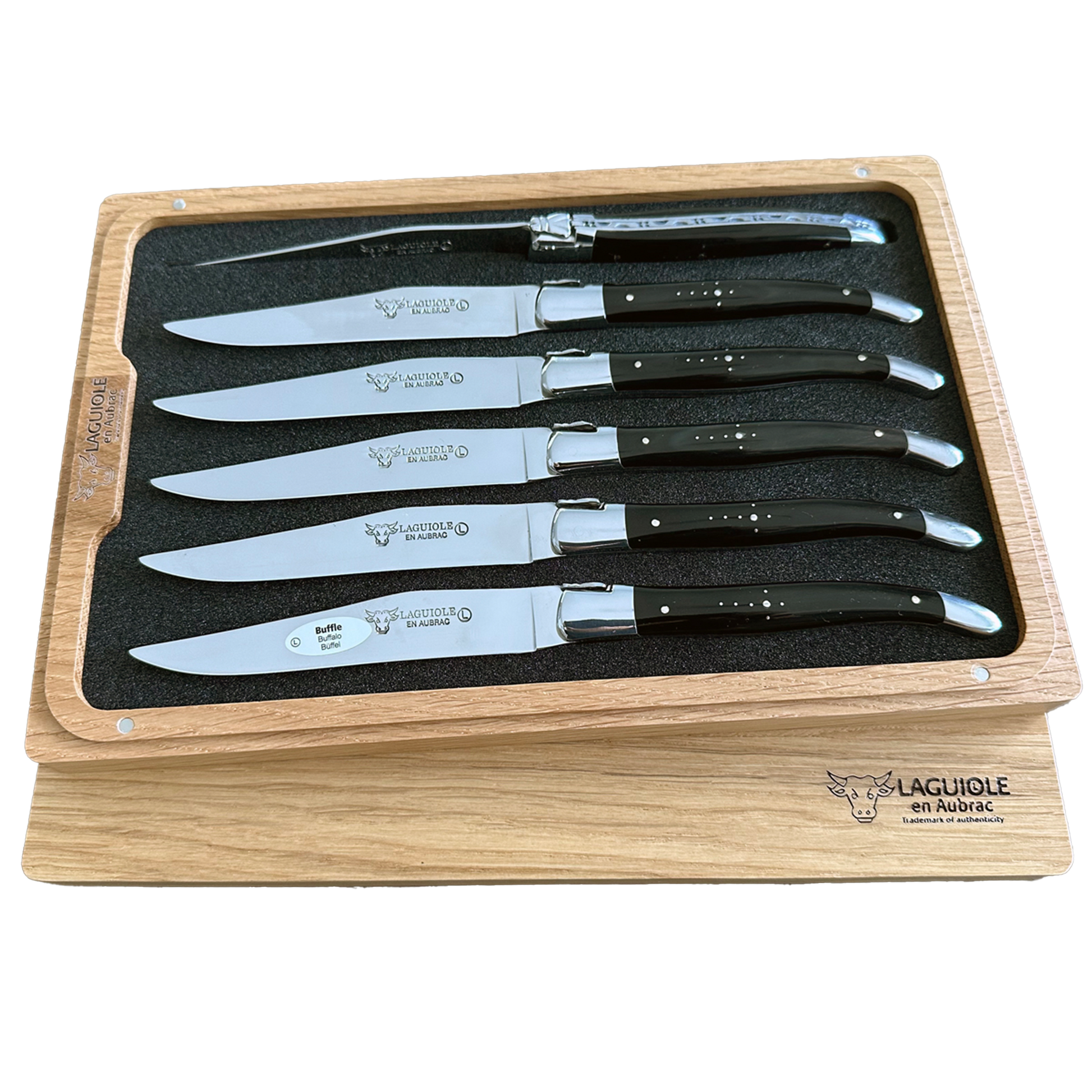 Set of steak knives in a wooden box with 'Laguiole en Aubrac' branding.