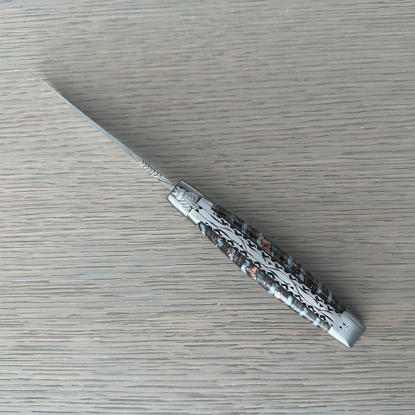 Open Laguiole en Aubrac Double-Plated folding knife with Light Brown Molar handle.