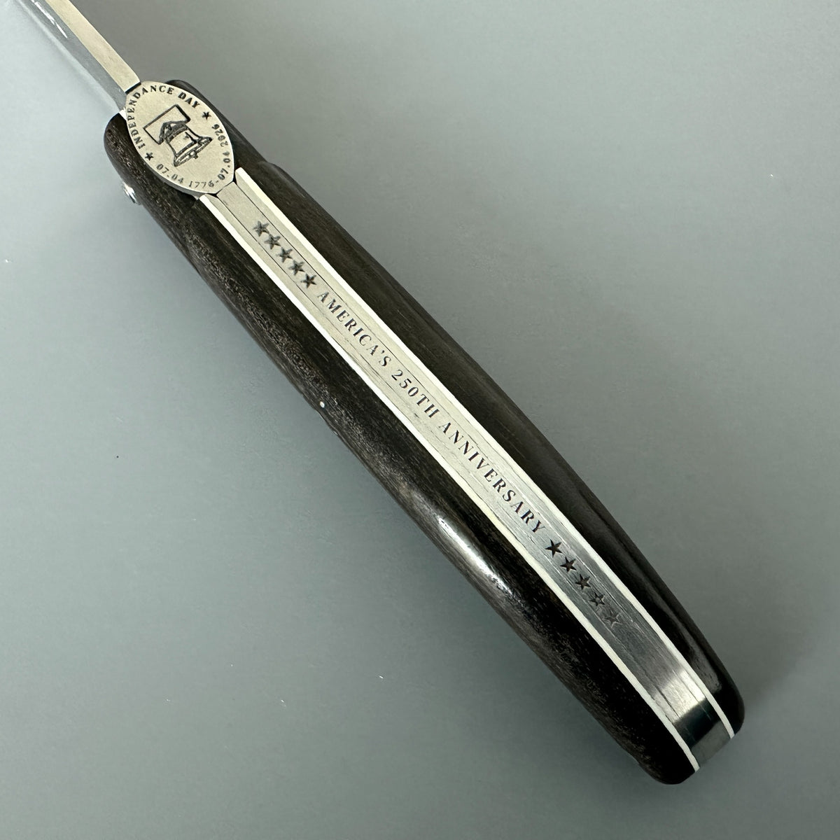 Close-up Laguiole en Aubrac USA Independence 250 anniversary folding pocket knife Spine with Ebony Handle