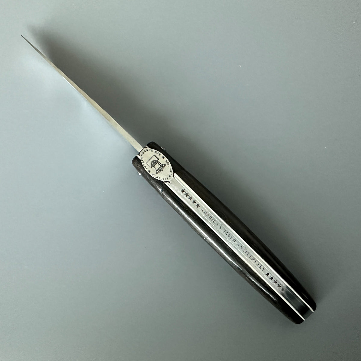 Cenital view of Laguiole en Aubrac USA Independence 250 anniversary folding pocket knife with Ebony Handle