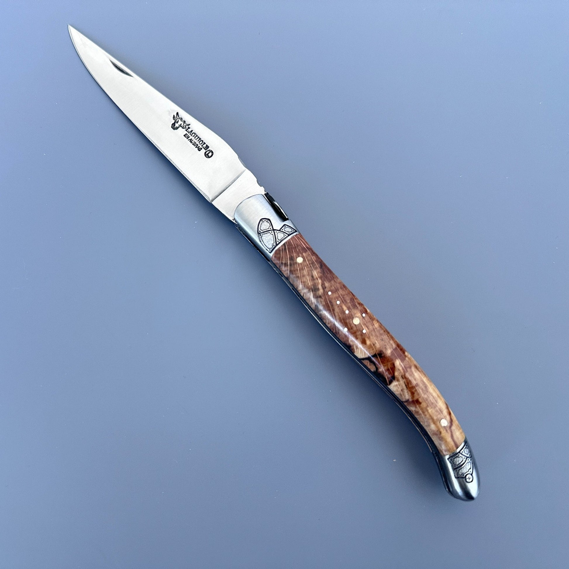 Open Laguiole en Aubrac Belle knife with Aubrac wood handle, black inlay and guilloché bolsters