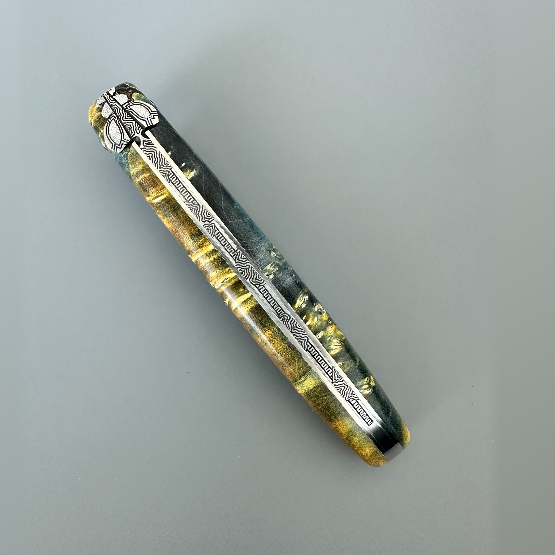 Closed Laguiole en Aubrac Belle knife showing the hand-carved special bee and decorated spine