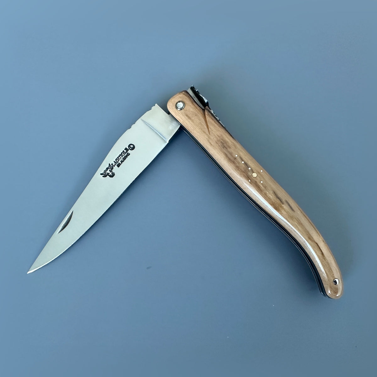 Partially closed Laguiole en Aubrac Belle Piece L0512IVH/FS-BP53 knife with a light-toned 