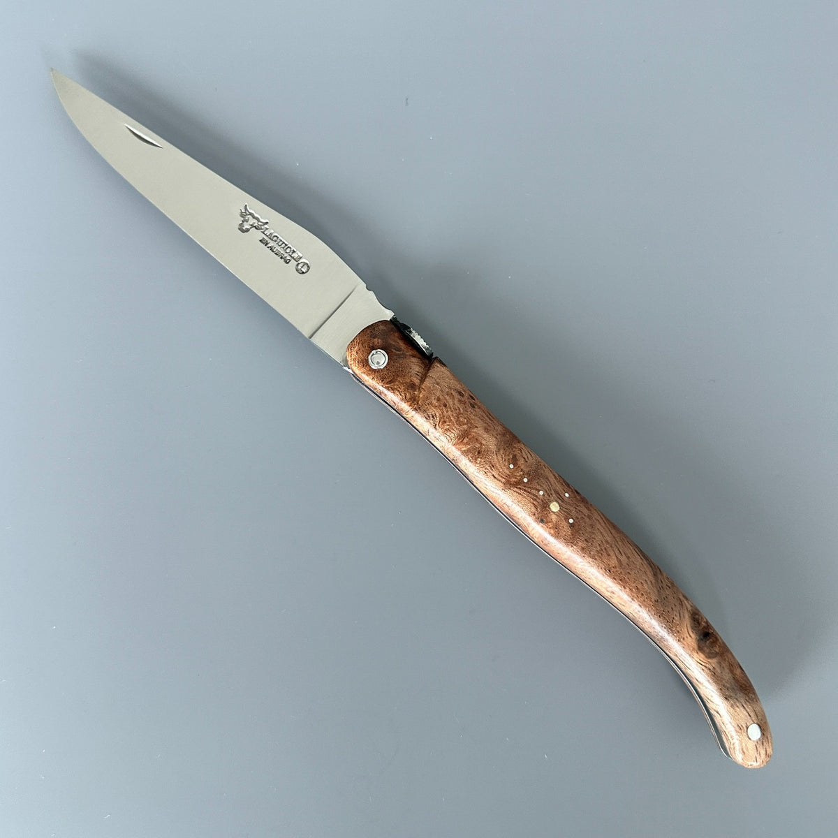 Fully open Laguiole en Aubrac Belle Piece partially open folding knife with Albizia handle