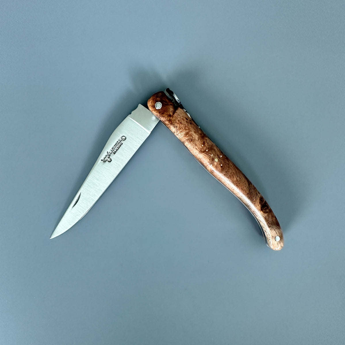 Laguiole en Aubrac partially open folding knife with Albizia handle