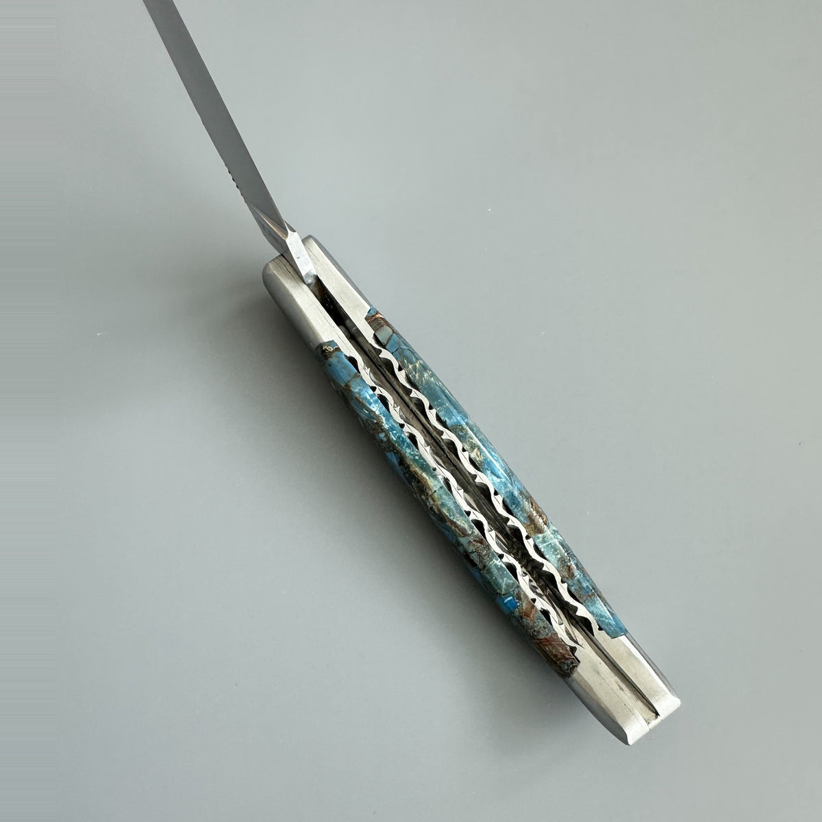 Inner spine of Laguiole en Aubrac Folding Knife with Blue Fusion Mammoth Ivory handle.