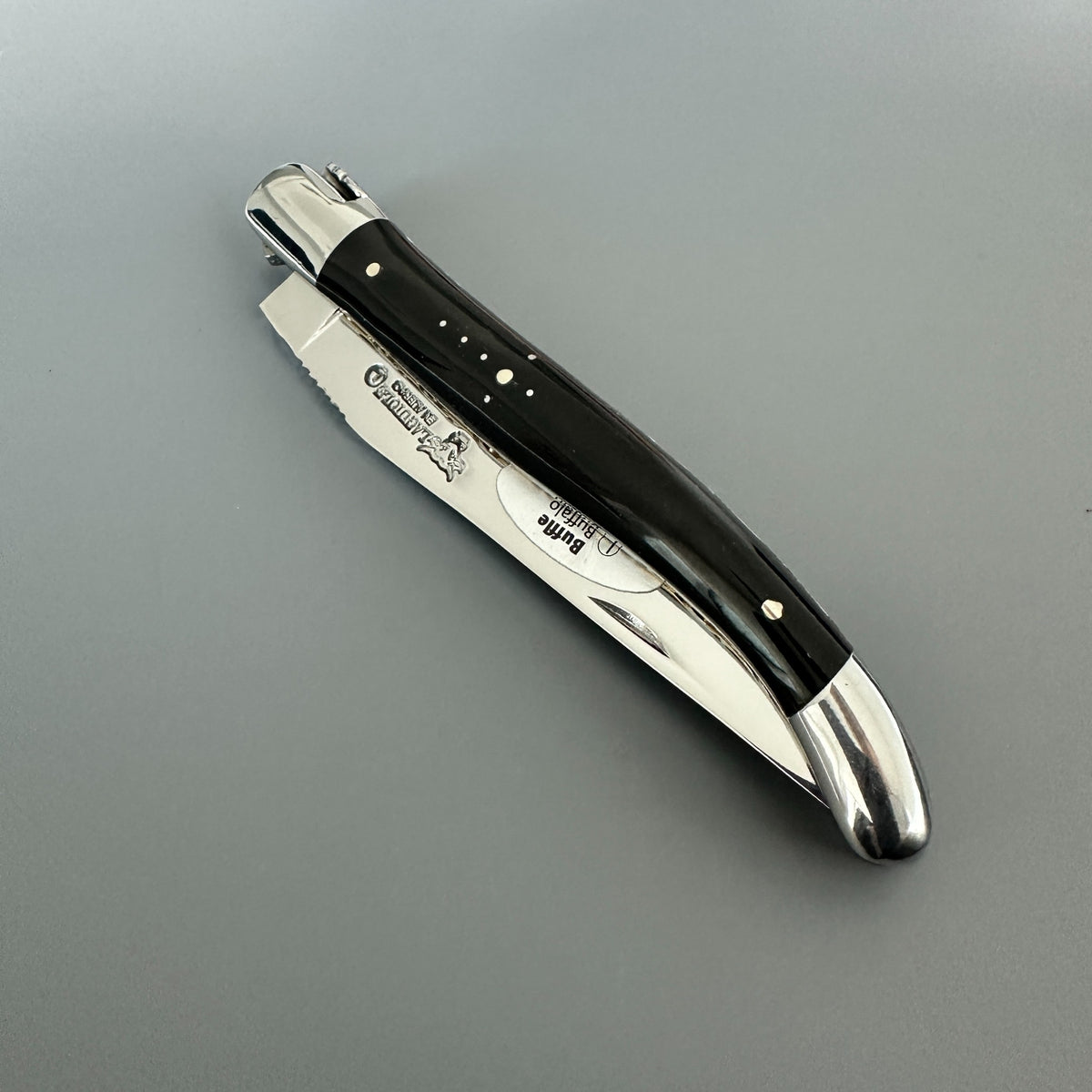 Laguiole en Aubrac double-plated pocket knife with a buffalo horn handle in closed position