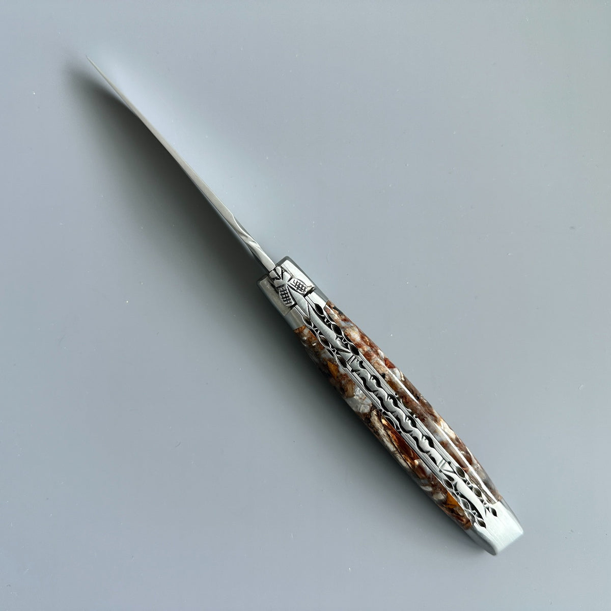 Cenital view of Laguiole en Aubrac Folding Knife with Fusion Mammoth Ivory handle handle.