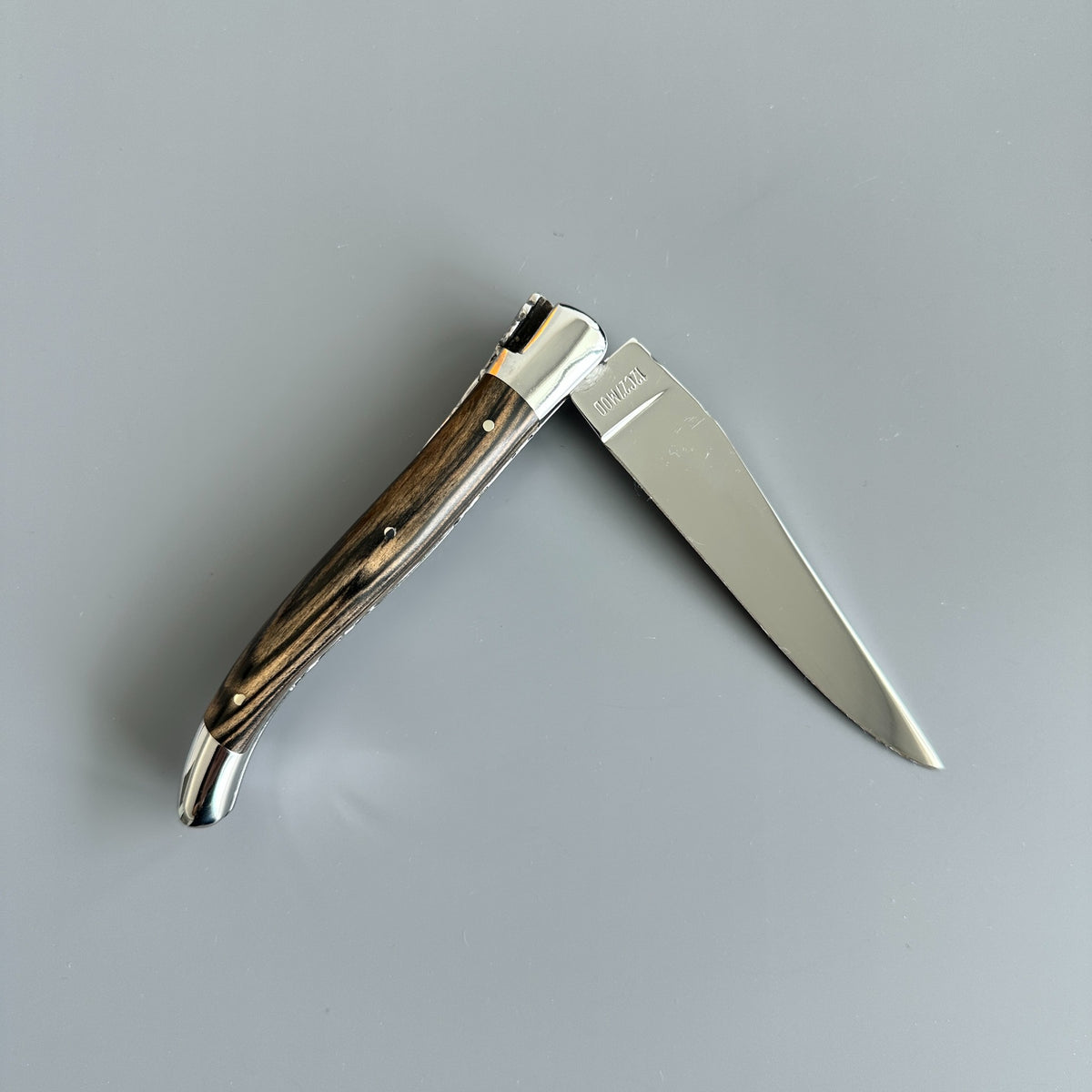 laguiole-en-aubrac-double-plated-royal-ebony-partly-open-reverse-view.