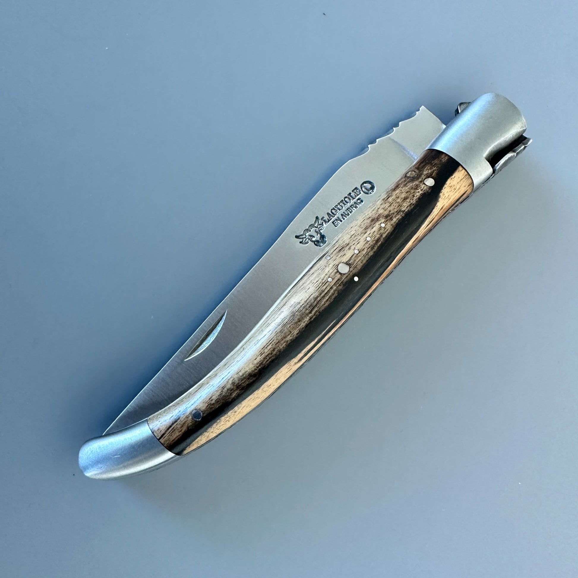 Close-up of the Royal Ebony handle and interior construction of the Laguiole en Aubrac hand-carved folding knife.