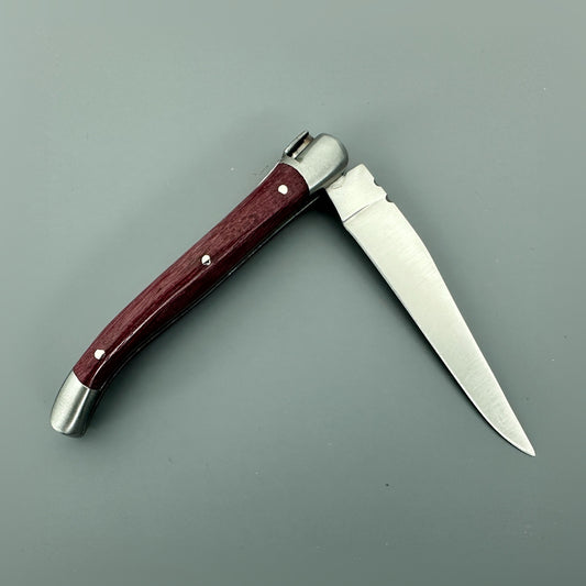 Reverse view of the open Laguiole en Aubrac Mini Folding Knife with an Amaranth wood handle.