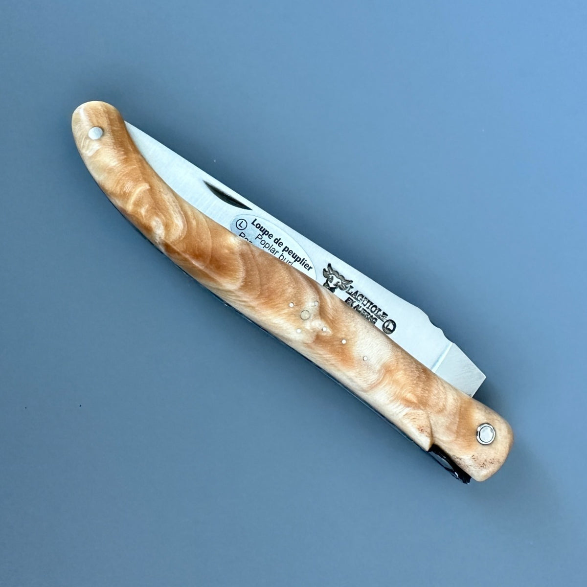 Closed Laguiole en Aubrac poplar folding knife.