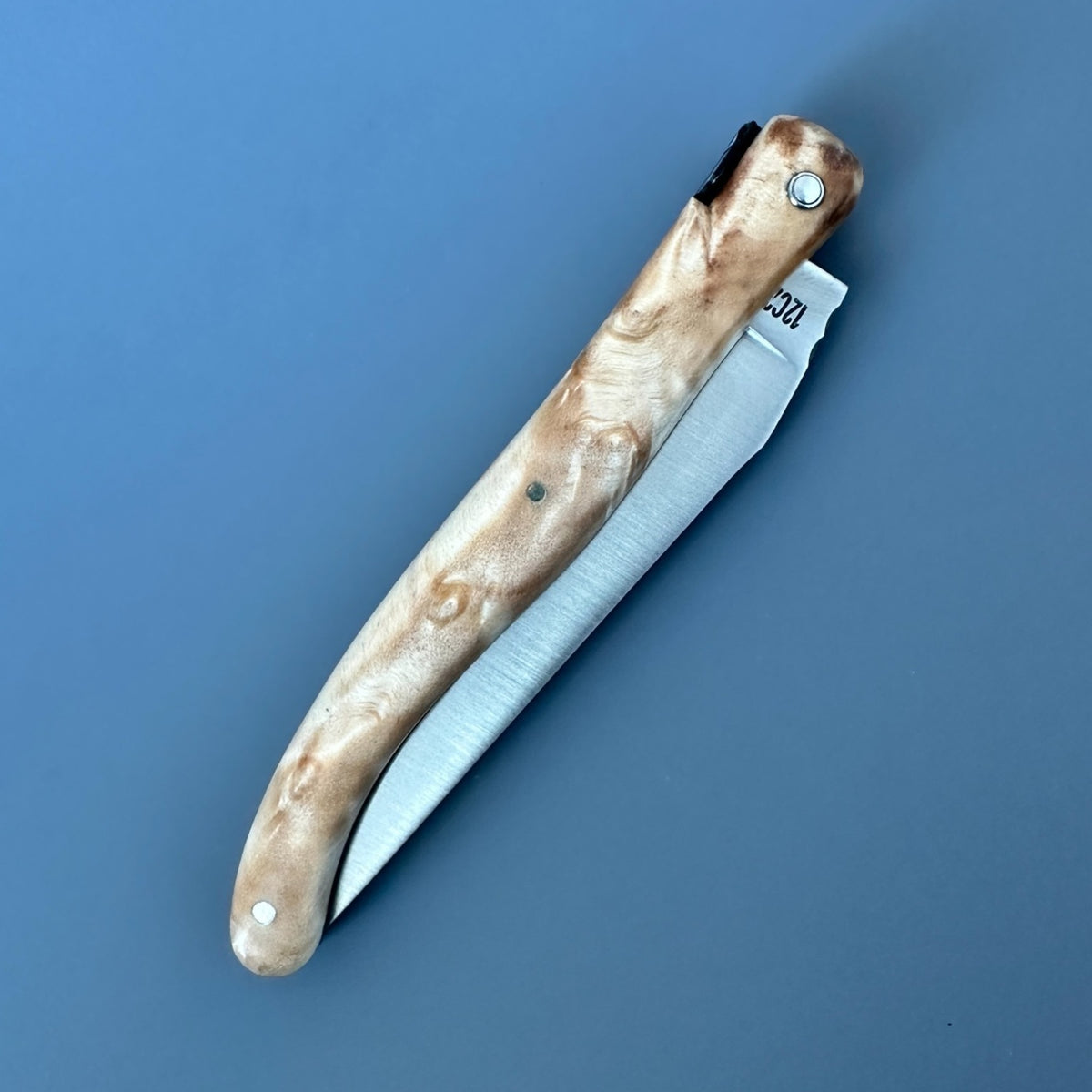 Reverse closed Laguiole en Aubrac poplar folding knife.