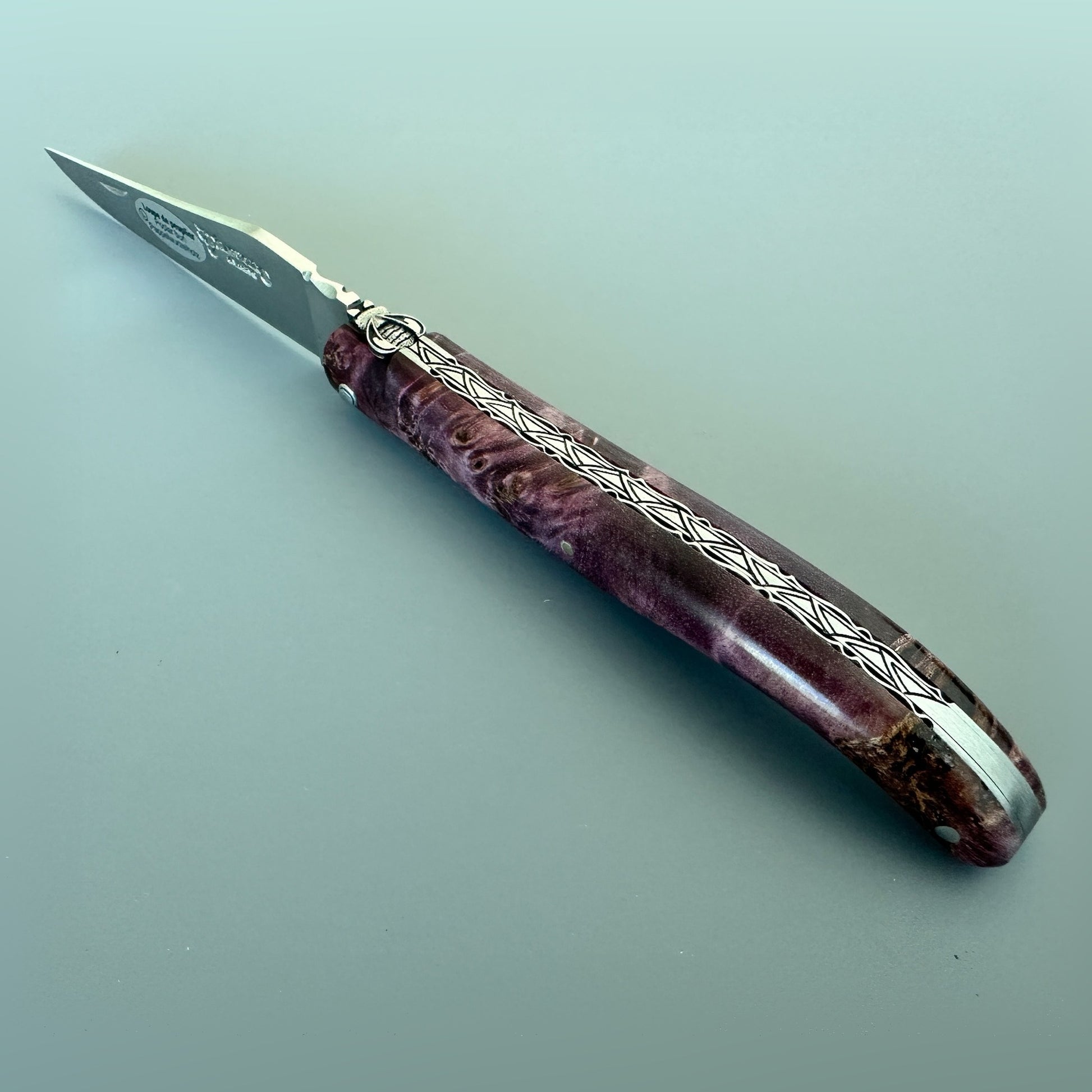 Open Laguiole en Aubrac L0512WPH/FS-BP55 knife with a Purple Poplar Burl handle and satin blade