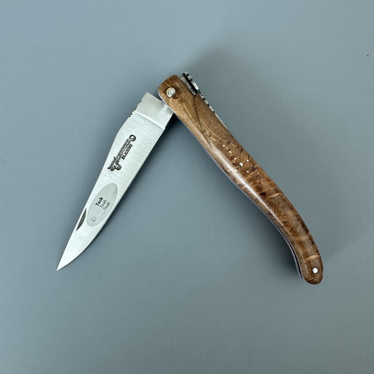 A folding pocket knife with a silver stainless steel blade and a brown wood-grain handle, shown open on a solid gray background.